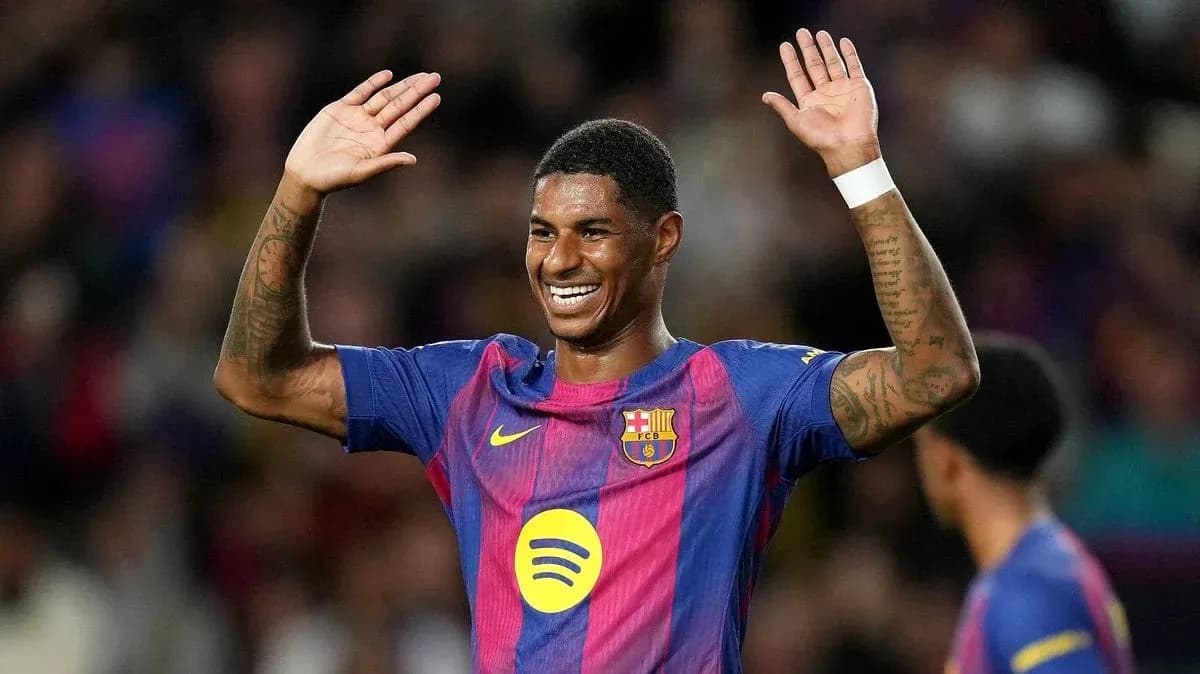 Barcelona player celebrating with raised hands