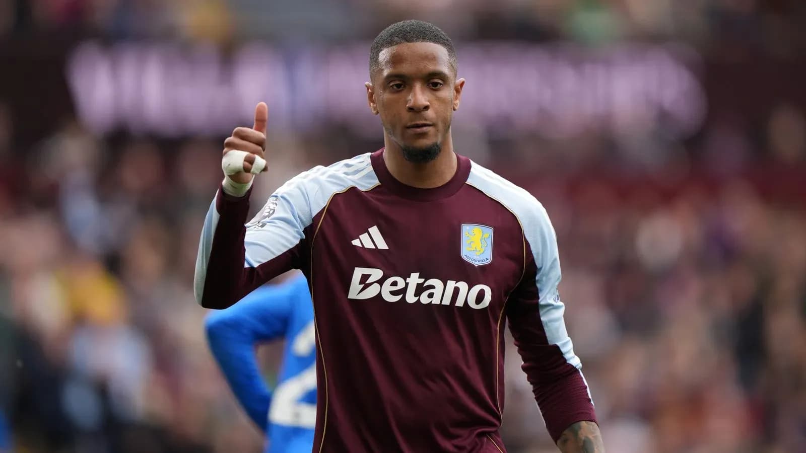 Goalkeeper in Aston Villa kit giving thumbs up