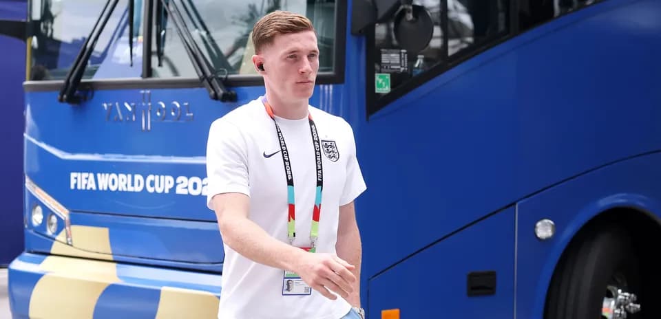 Player walking near team bus at World Cup