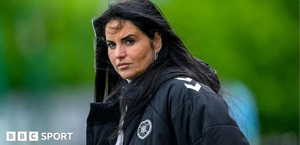 Coach observing training session outdoors