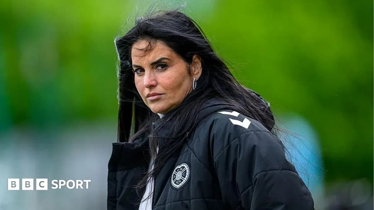 Coach observing training session outdoors