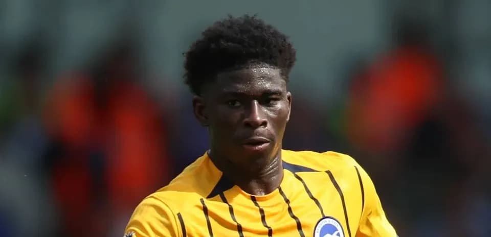Player in yellow kit running during match