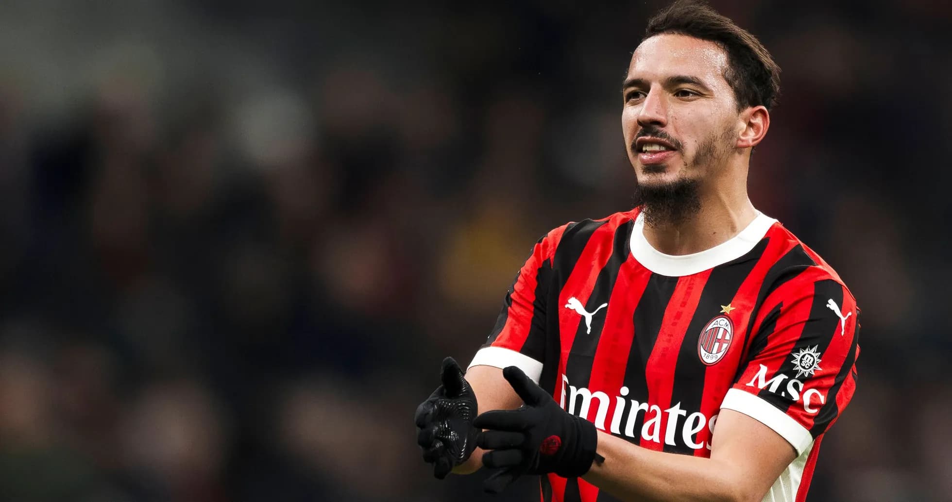 AC Milan player gesturing during match action