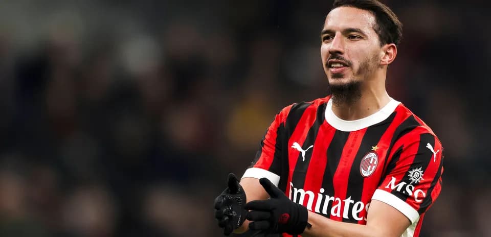 AC Milan player gesturing during match action