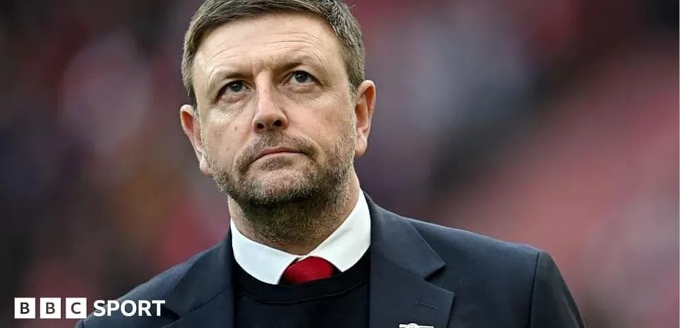 Manager looking on during a football match