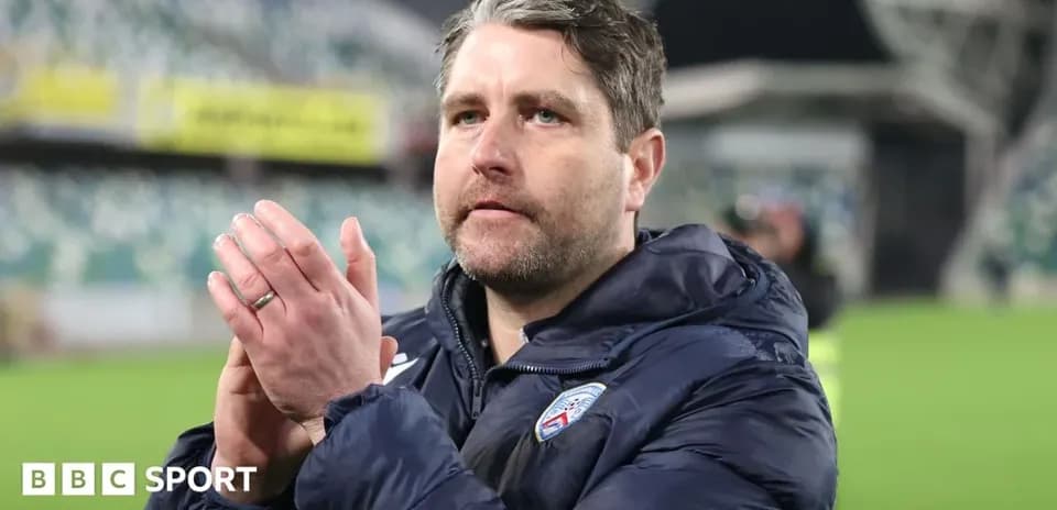 Coach applauding fans after the match
