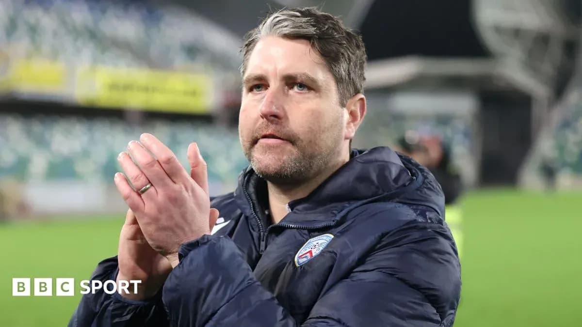Coach applauding fans after the match