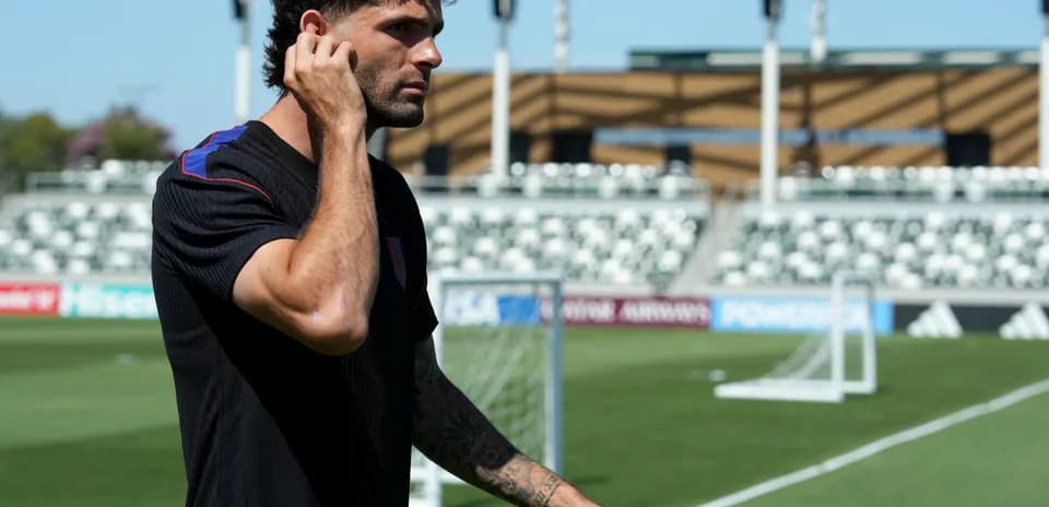 Player walking on football pitch before match