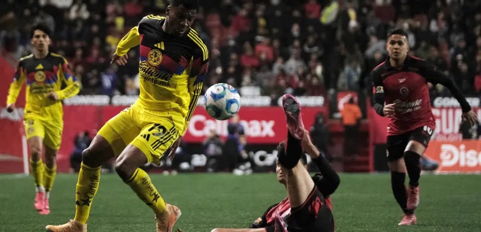 Club America player in action against Club Tijuana