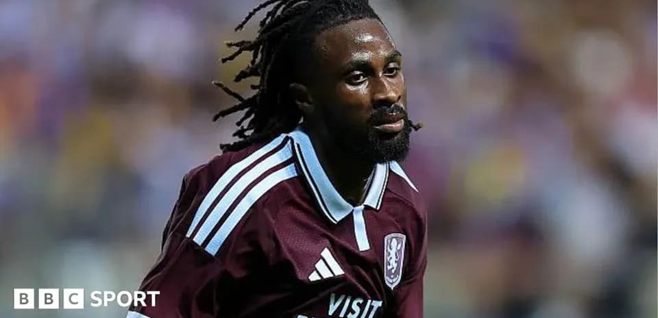 Player in maroon jersey running during match