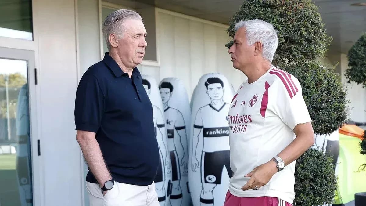 Two coaches talking outside training facility
