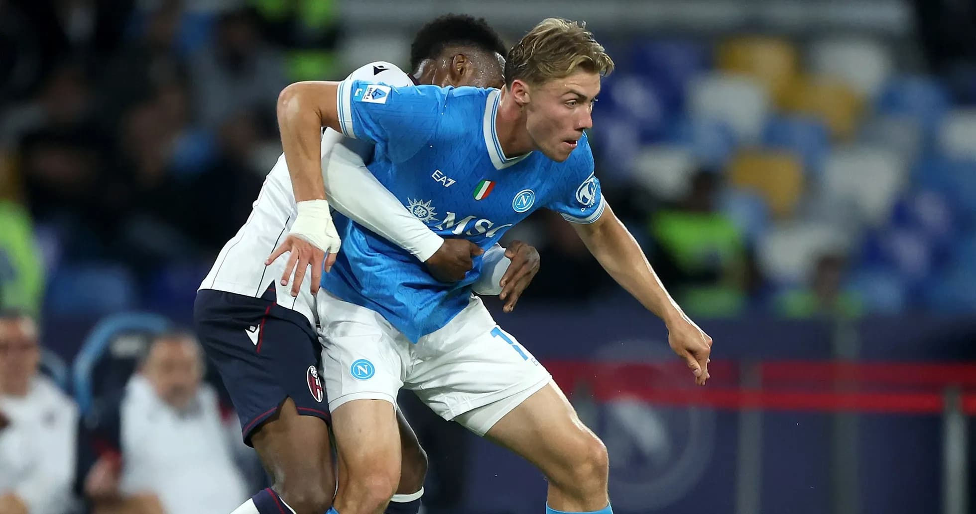 Napoli player challenged by opponent during match