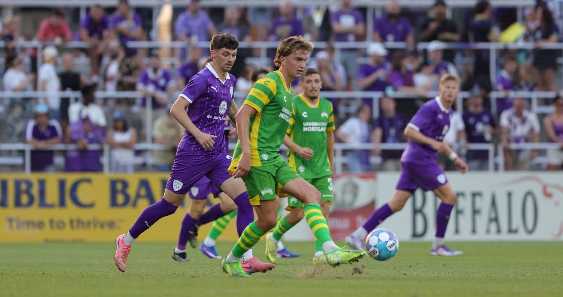 Players competing for the ball during match