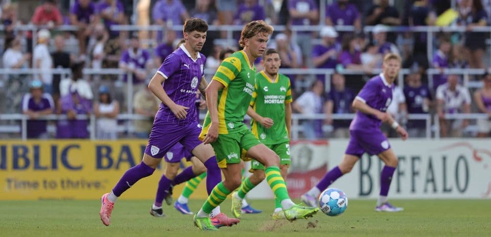 Players competing for the ball during match