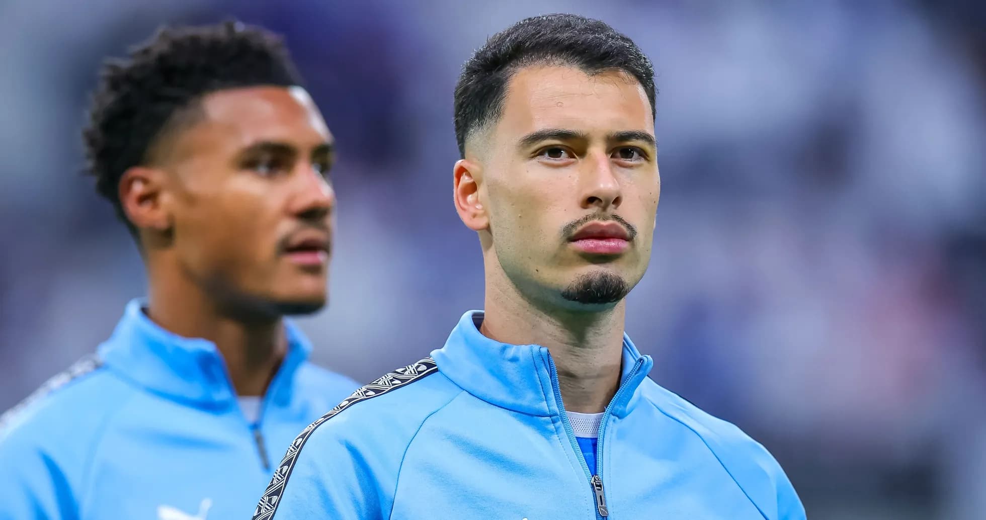 Two players in training kits during warm-up