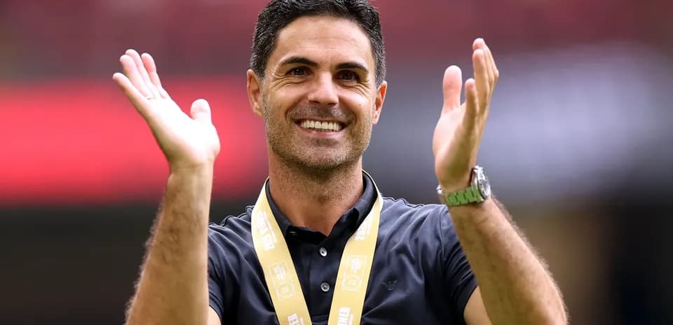 Coach celebrating with medal at event