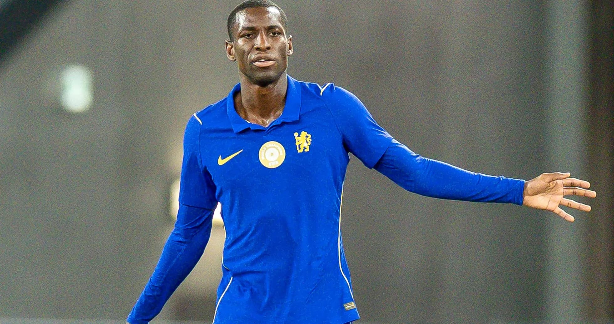 Player in blue jersey gesturing during training session