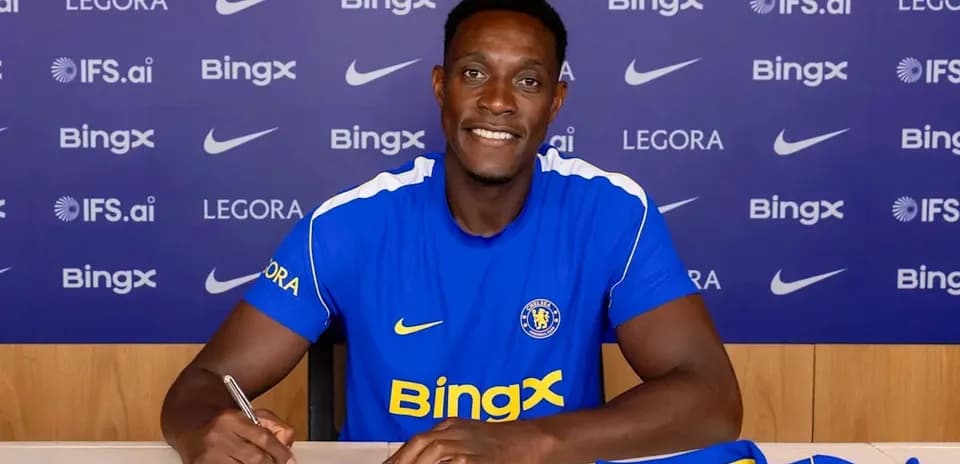 Player signing contract at club announcement event