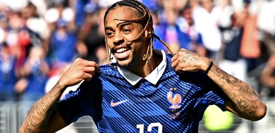 Player celebrating with France jersey during match