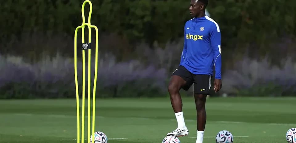 Player practicing dribbling around training cones