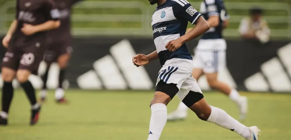 Player dribbling the ball during football match