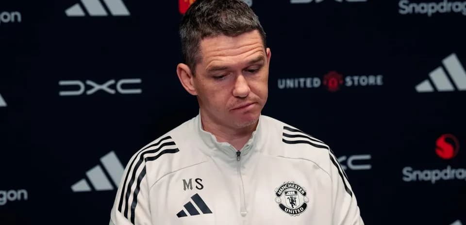 Manchester United manager at press conference podium