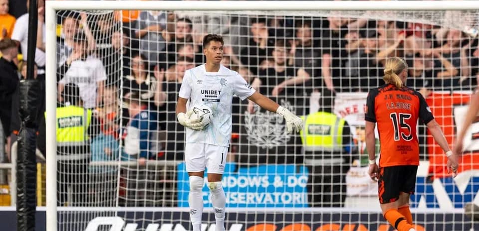 Goalkeeper standing in front of the goal during match
