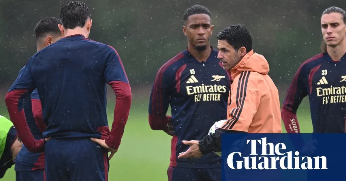 Manager discussing tactics with players during training