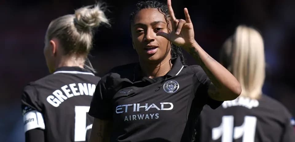 Player gesturing while teammates stand behind her