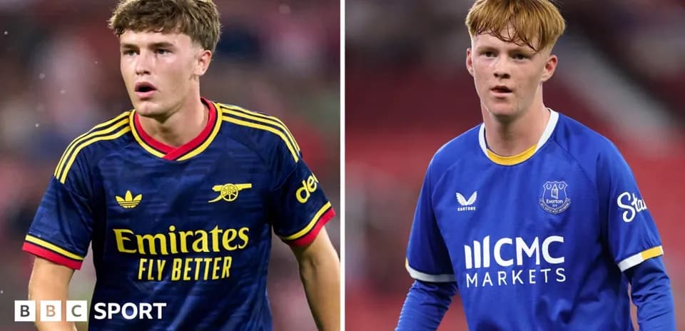 Two young football players in team kits