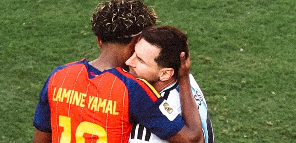 Two players embracing on the field after match