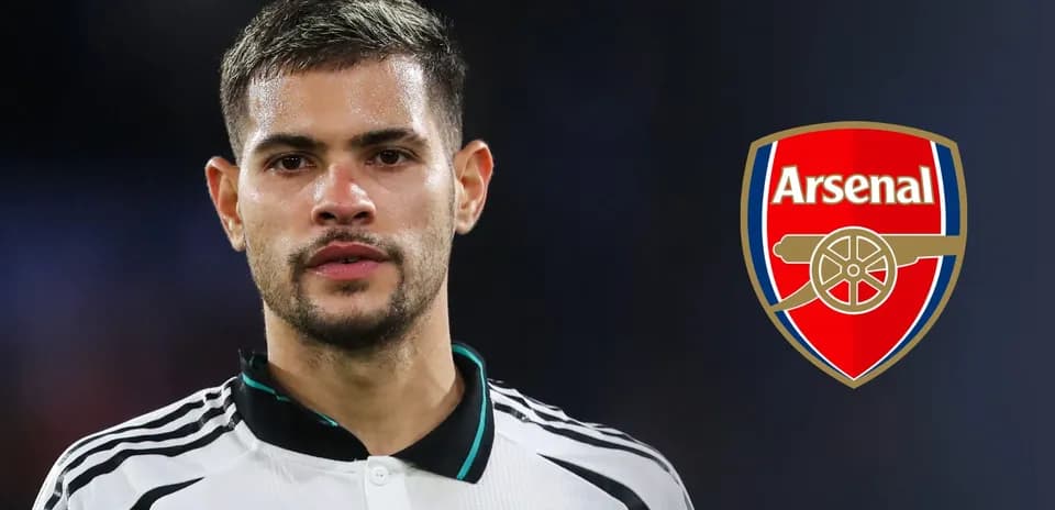 Player in Arsenal jersey with club logo background