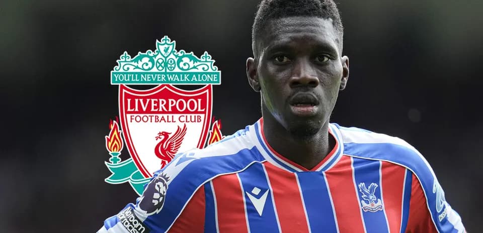 Player in Crystal Palace jersey with Liverpool logo background