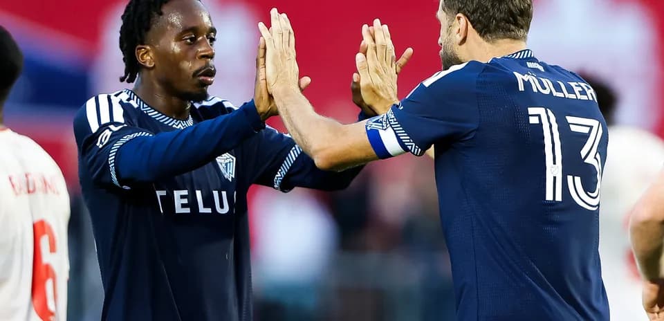 Players celebrating during Vancouver FC match