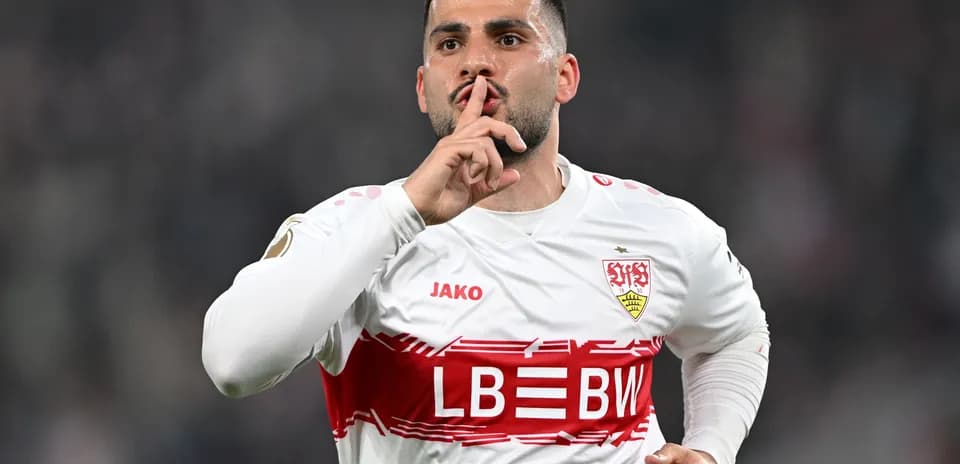 Player celebrating goal with a shushing gesture