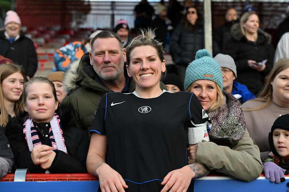 Player celebrating with fans at the stadium