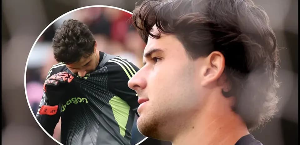 Goalkeeper adjusting jersey during match warm-up