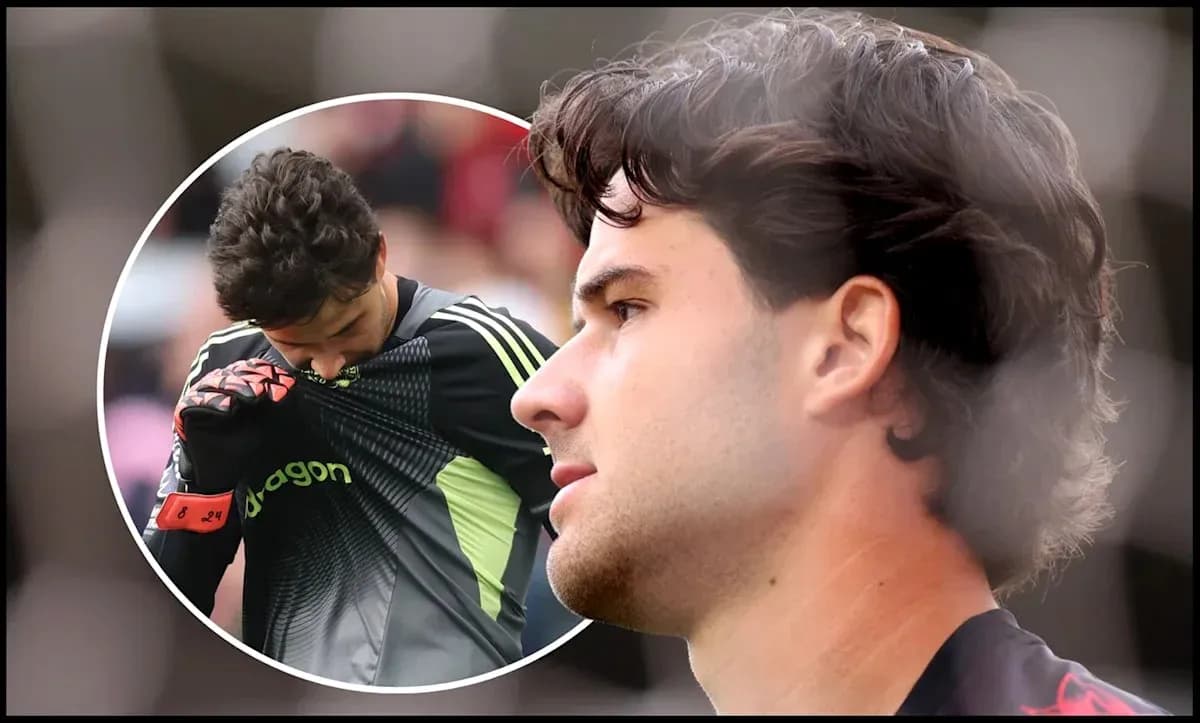 Goalkeeper adjusting jersey during match warm-up