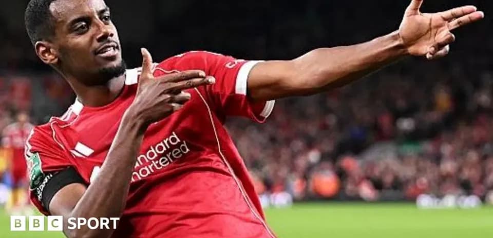 Player celebrating goal with signature pose on field
