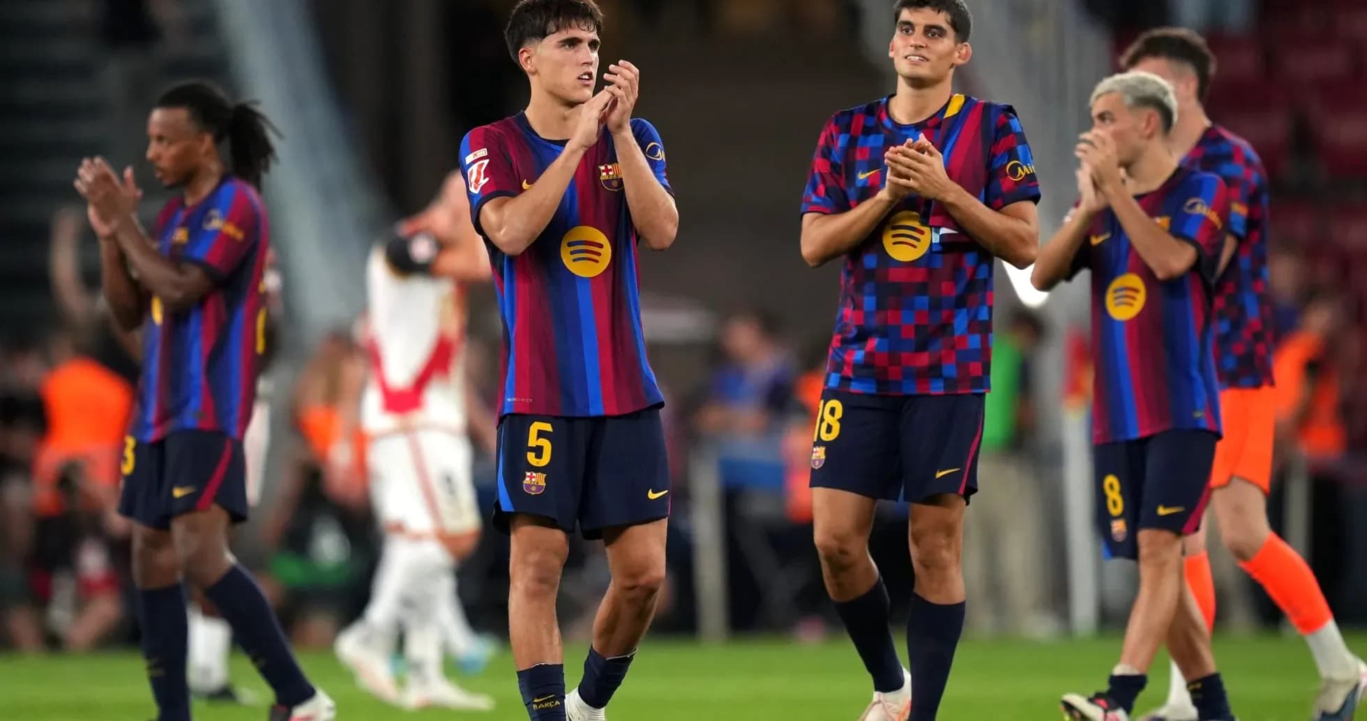 Barcelona players applauding fans after match