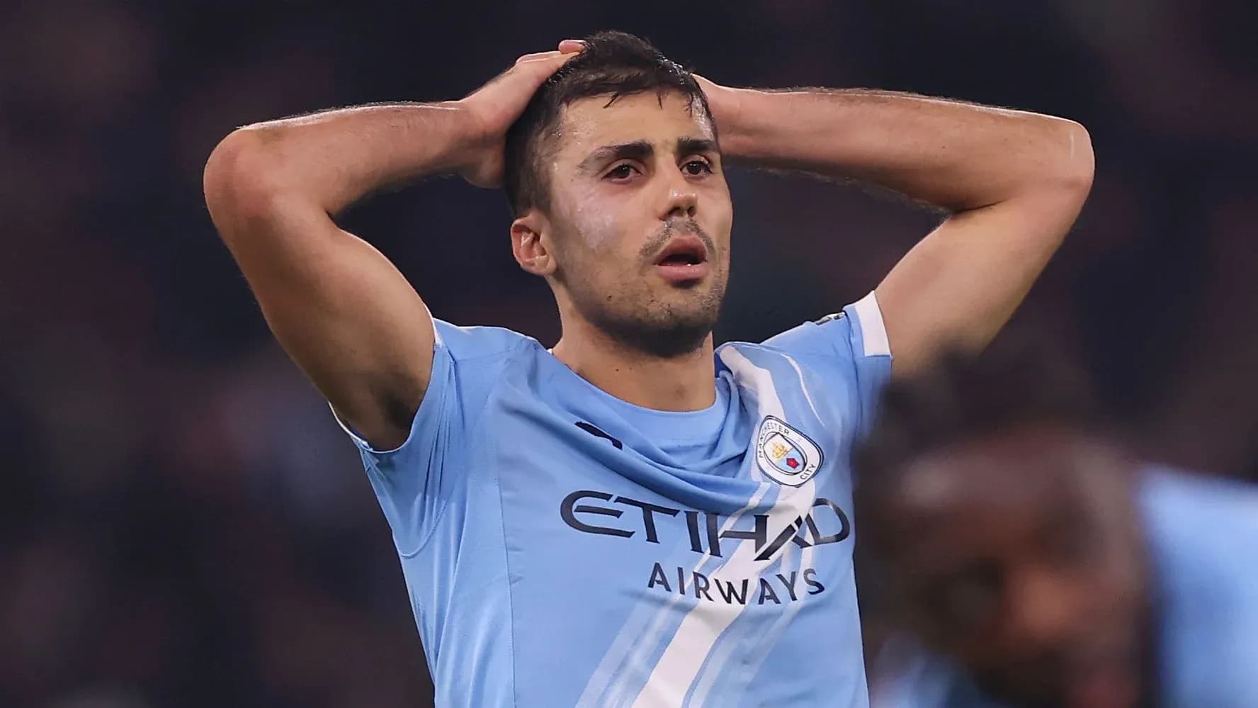 Player holding head in frustration during match
