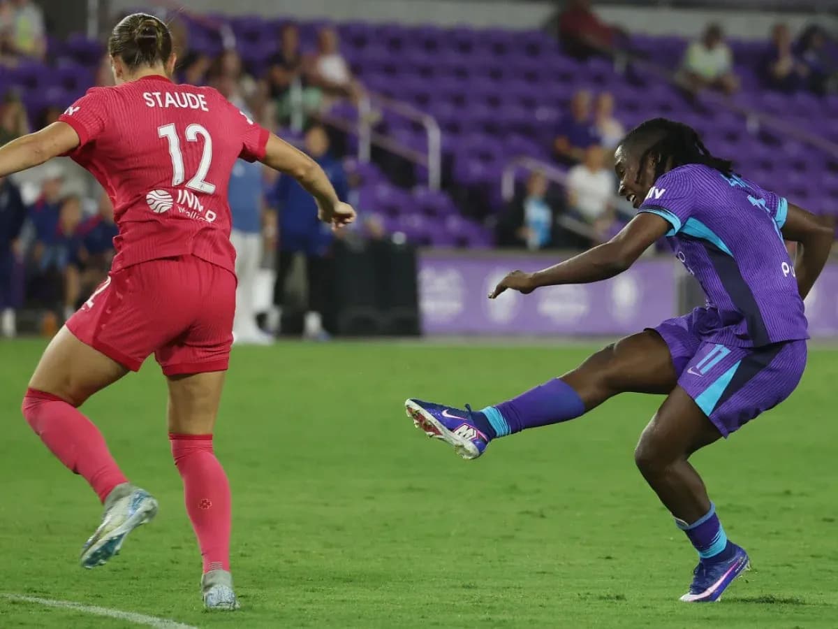 Player kicking the ball during match