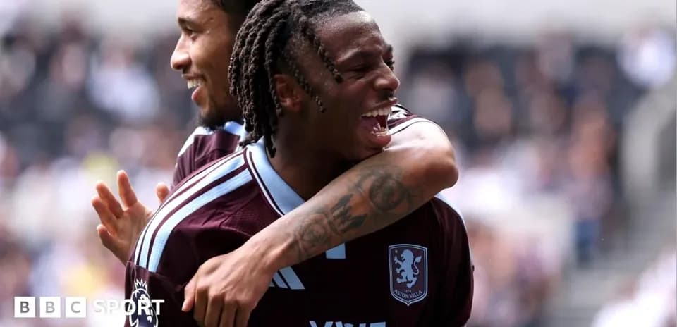 Aston Villa players celebrating a goal on field