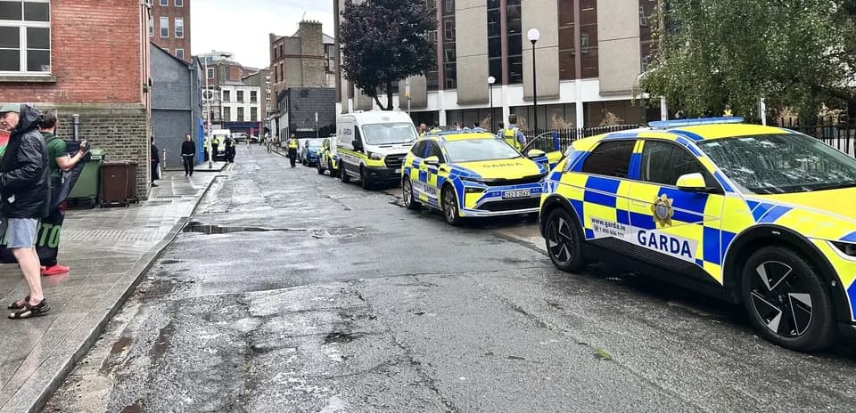 Several Garda vehicles parked on a city street