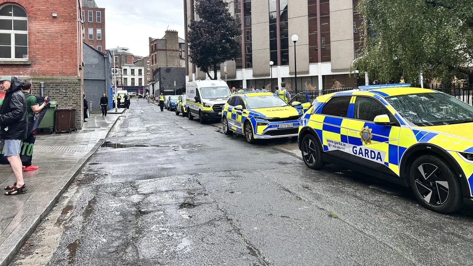 Several Garda vehicles parked on a city street