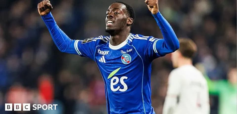 Player celebrating with raised arms in blue jersey
