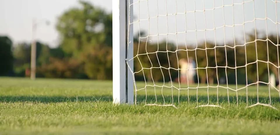Close-up of soccer goalpost and netting