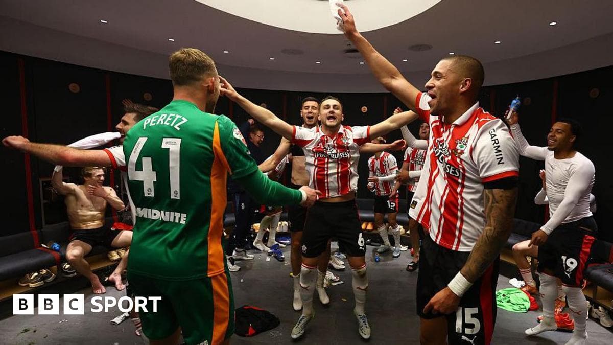 Team celebrating in locker room after match victory
