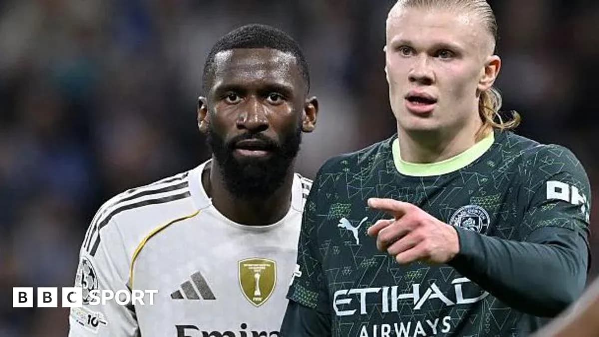 Two players from opposing teams on the pitch