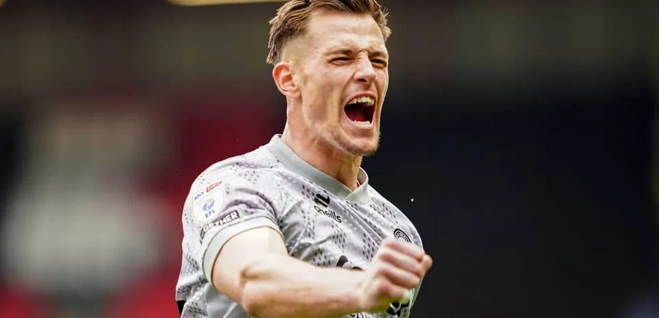 Player celebrating passionately on the pitch